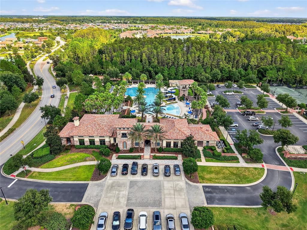 29241 Perilli Place Wesley Chapel, FL 33543 - Photo 48 of 53 an aerial view of a house with a garden and lake view