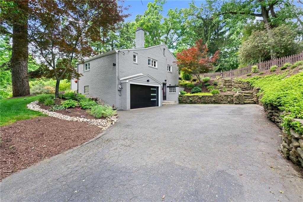 Large driveway can fit multiple cars for your guests.