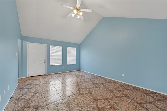 a view of an empty room with a window