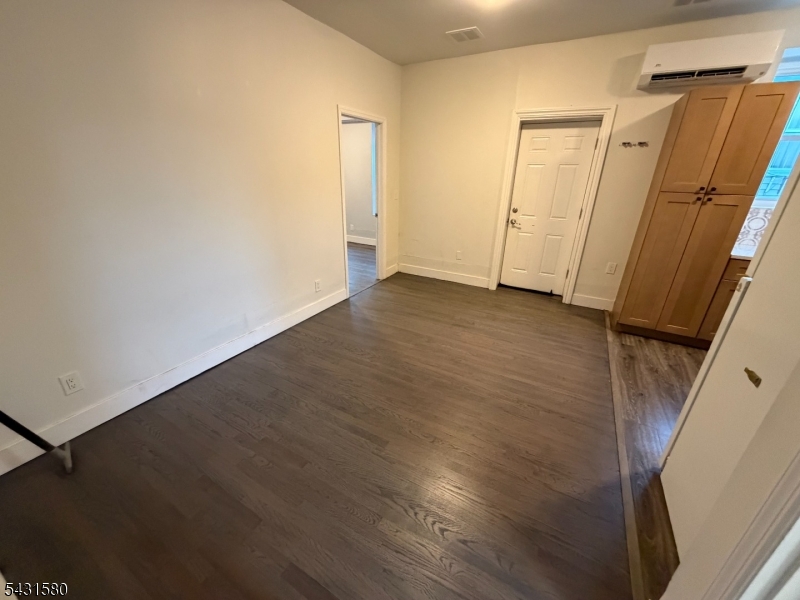 64 Mott Street, Unit 2 Newark, NJ 07105 - Photo 10 of 14 an empty room with wooden door