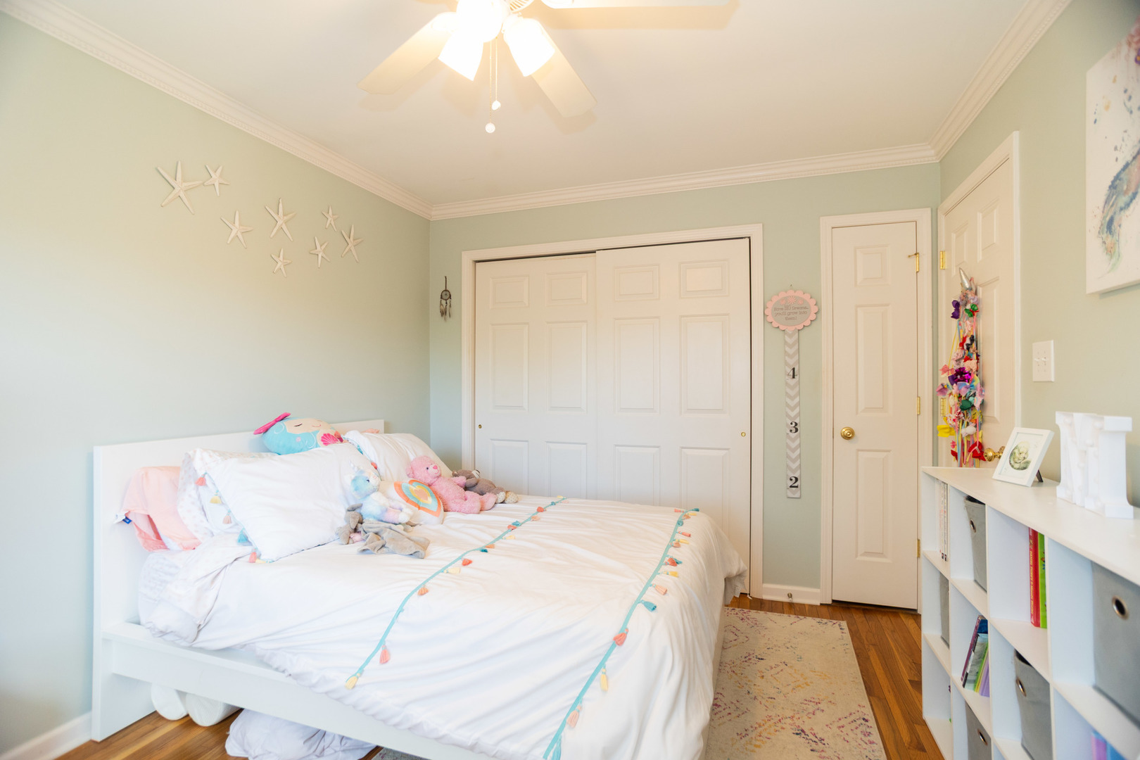 1485 Devonshire Lane Hoffman Estates, IL 60169 - Photo 12 of 27 a bedroom with a bed and a chandelier