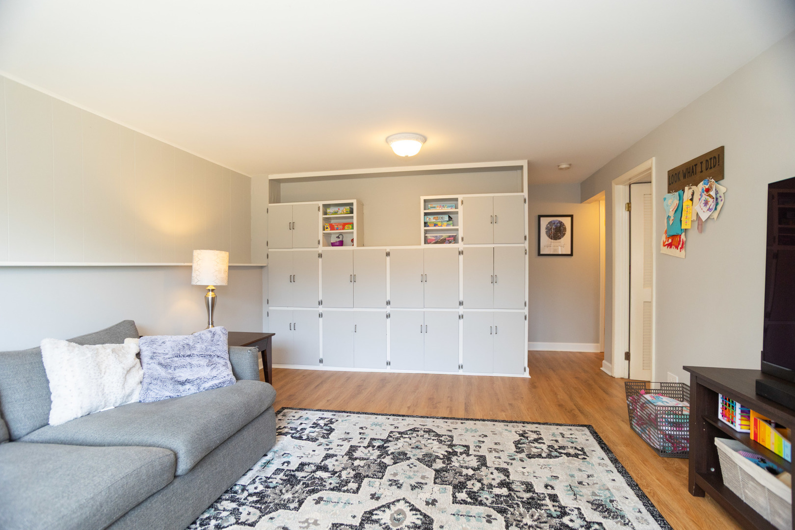 1485 Devonshire Lane Hoffman Estates, IL 60169 - Photo 17 of 27 a living room with a couch and a couch