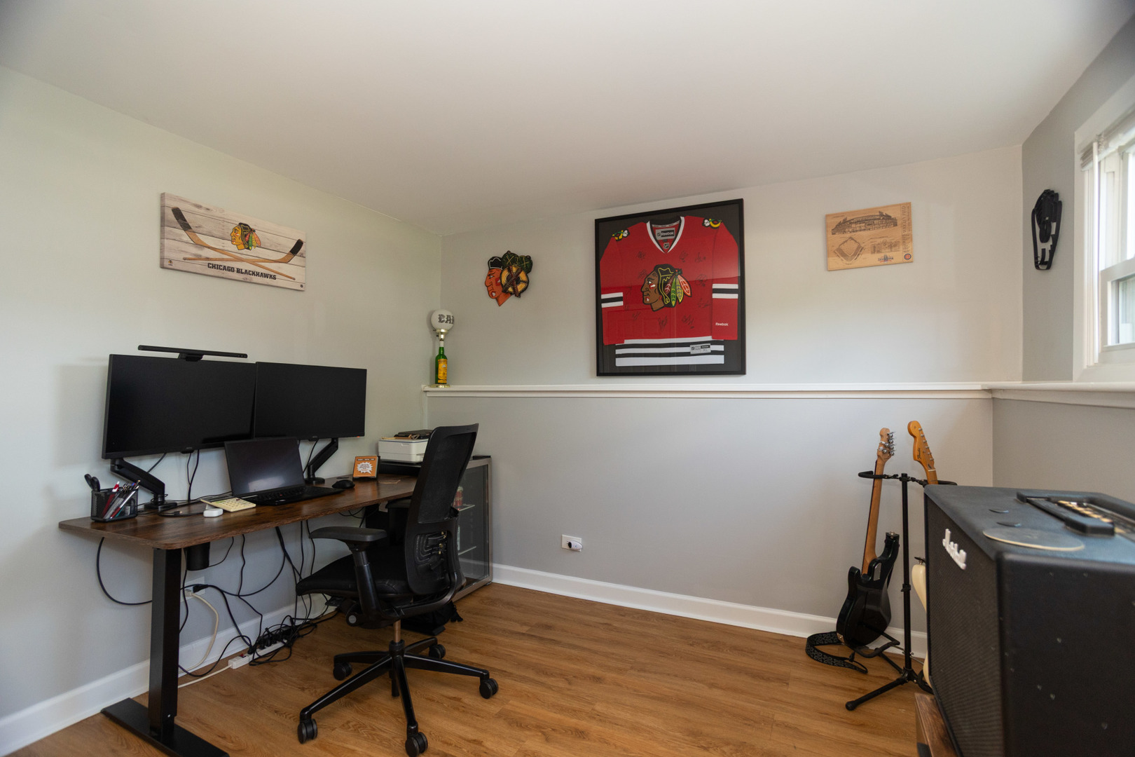 1485 Devonshire Lane Hoffman Estates, IL 60169 - Photo 19 of 27 a view of a workspace with furniture and wooden floor