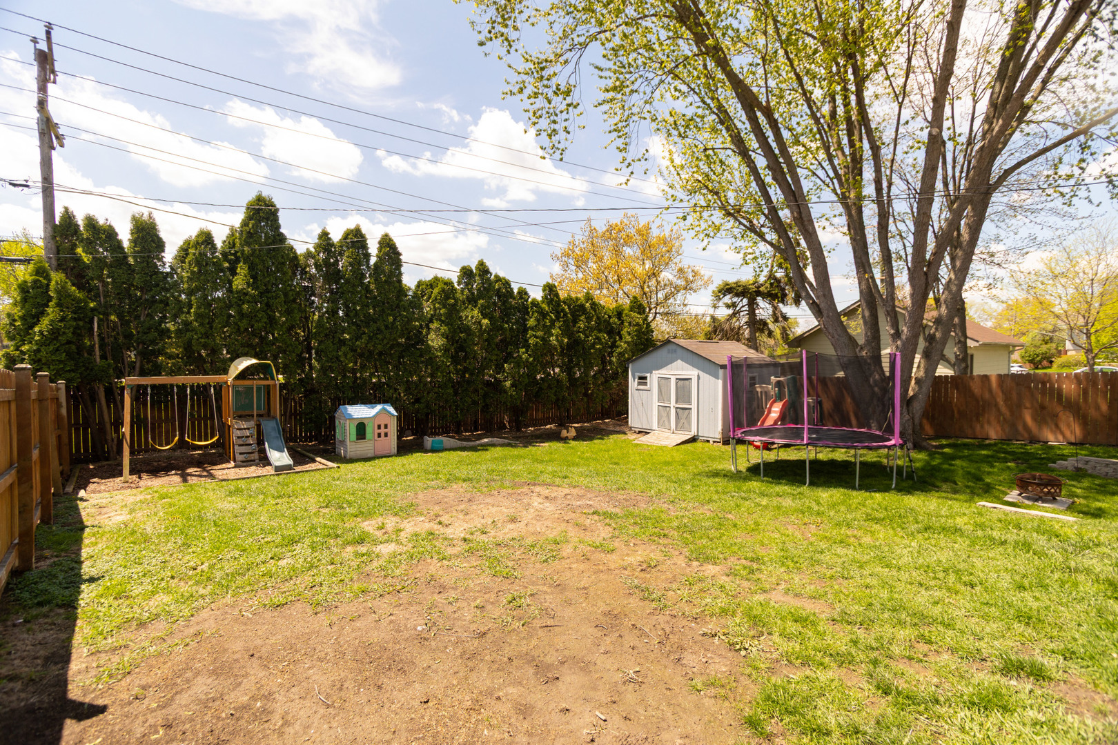 1485 Devonshire Lane Hoffman Estates, IL 60169 - Photo 24 of 27 a house with trees in front of it