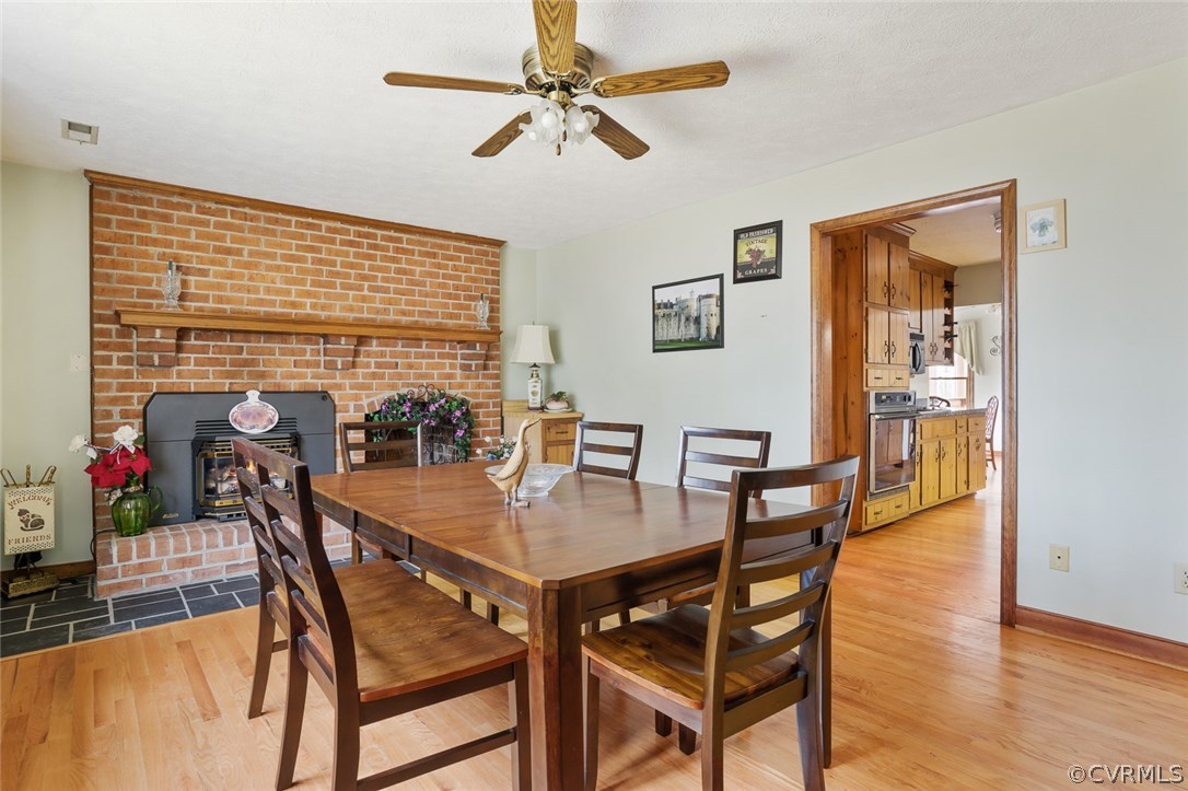 2810 Quaker Road Quinton, VA 23141 - Photo 17 of 38 a view of a dining room with furniture and wooden floor