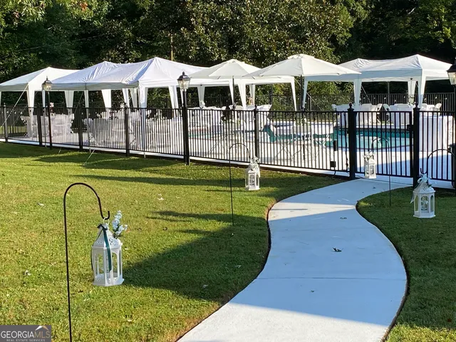 a front view of a house with swimming pool