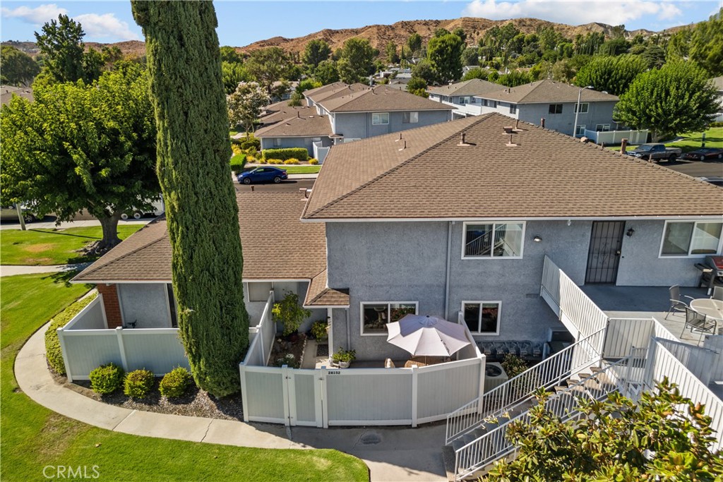 a view of house with a yard outdoor seating and mountain view