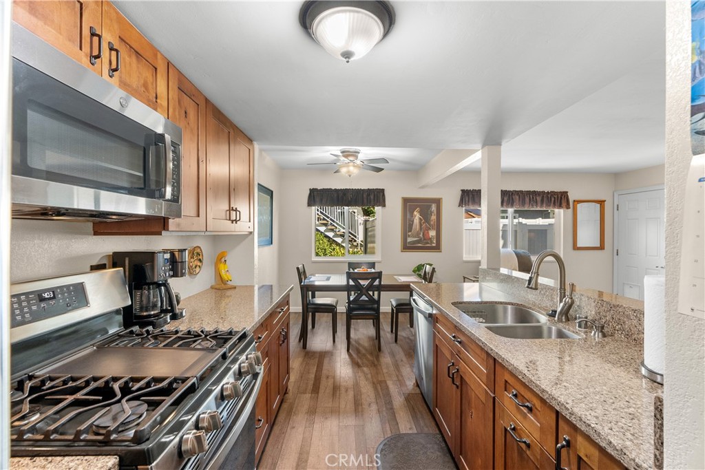 28152 Robin Avenue Saugus, CA 91350 - Photo 20 of 49 a kitchen with sink stove and cabinets