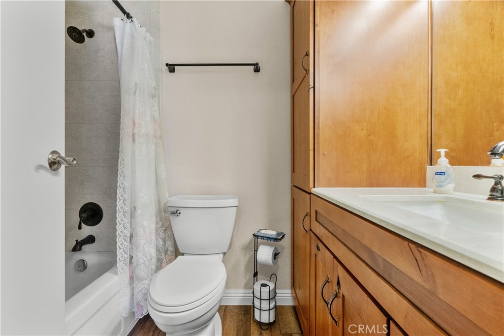 28152 Robin Avenue Saugus, CA 91350 - Photo 24 of 49 a bathroom with a granite countertop sink toilet and shower