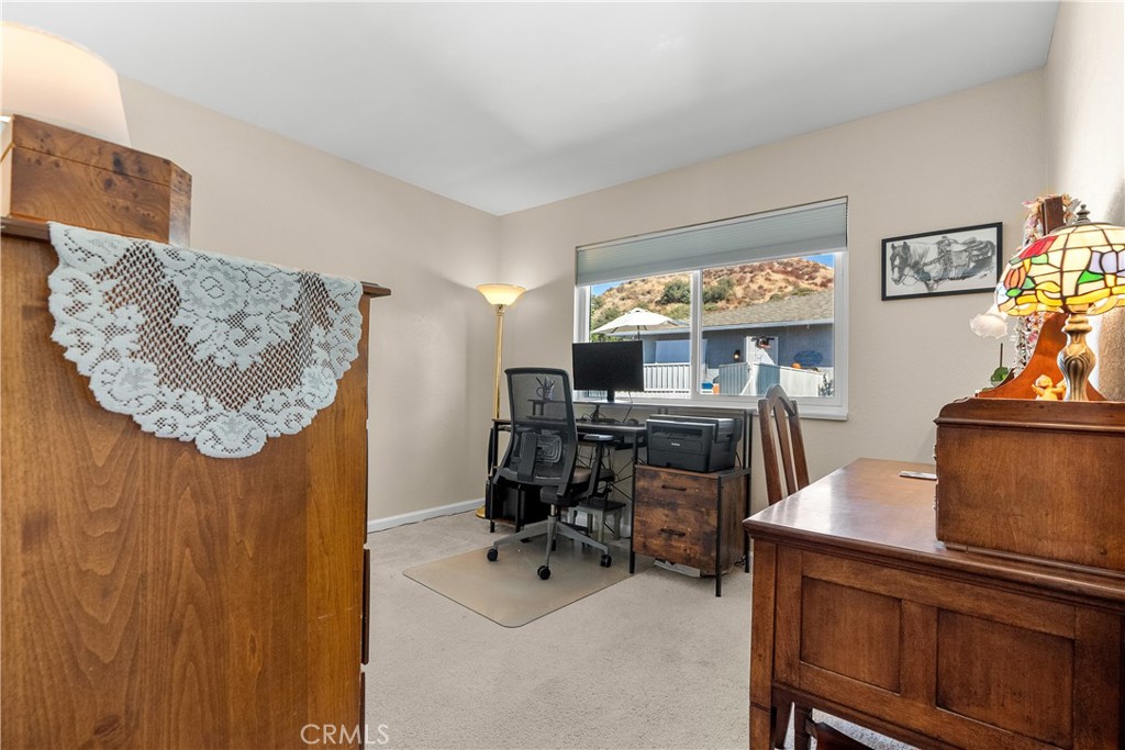 28152 Robin Avenue Saugus, CA 91350 - Photo 26 of 49 a view of a workspace with furniture and a flat screen tv