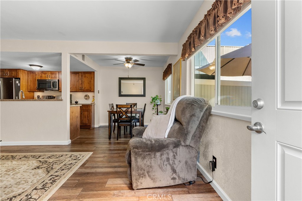 28152 Robin Avenue Saugus, CA 91350 - Photo 8 of 49 a living room with furniture a dining table and kitchen view