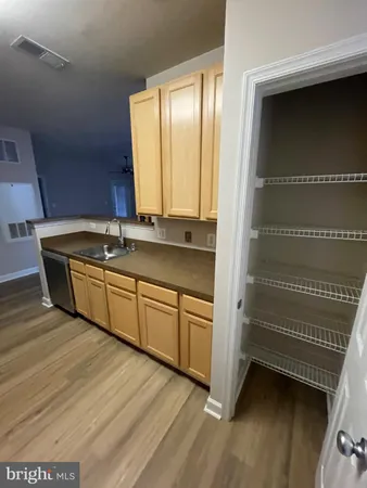 a room with a sink and a mirror