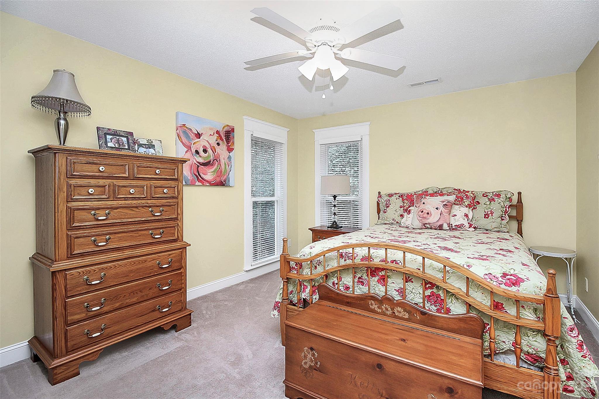 2717 Farmstead Lane Fort Mill, SC 29708 - Photo 18 of 43 a bedroom with a bed and a dresser in it