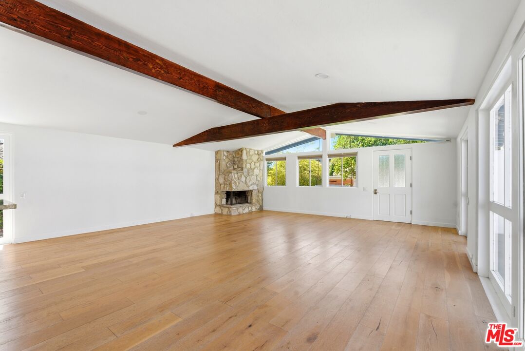 26 Packet Road Rancho Palos Verdes, CA 90275 - Photo 11 of 40 a view of empty room with wooden floor and fan