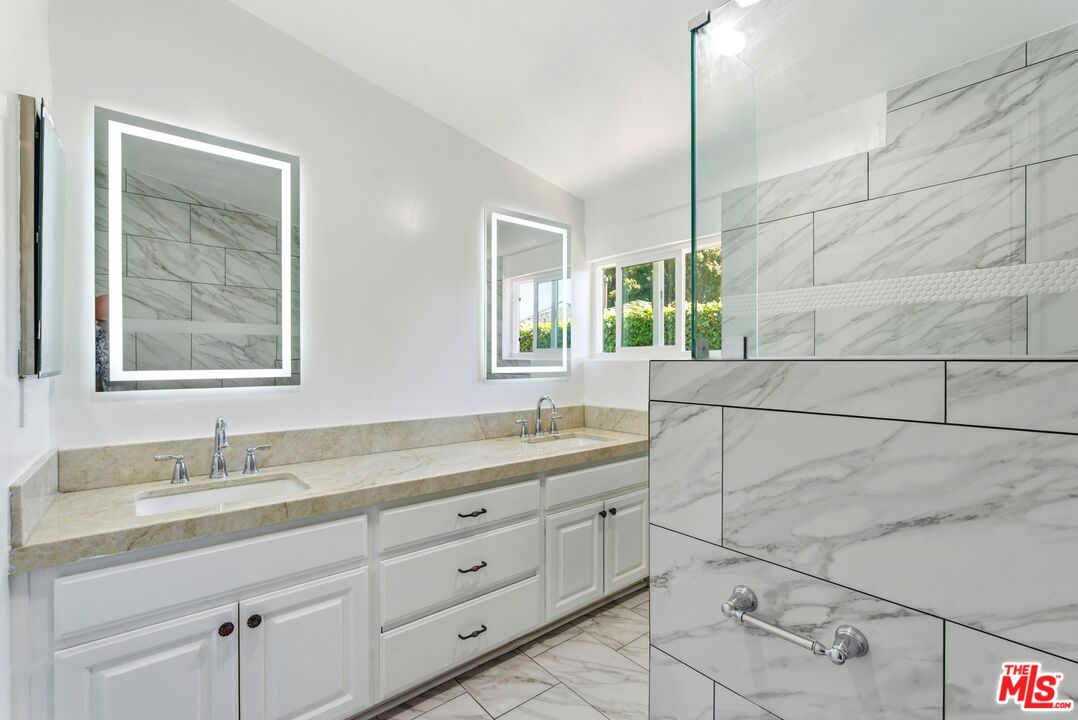 26 Packet Road Rancho Palos Verdes, CA 90275 - Photo 17 of 40 a bathroom with a double vanity sink window and mirror