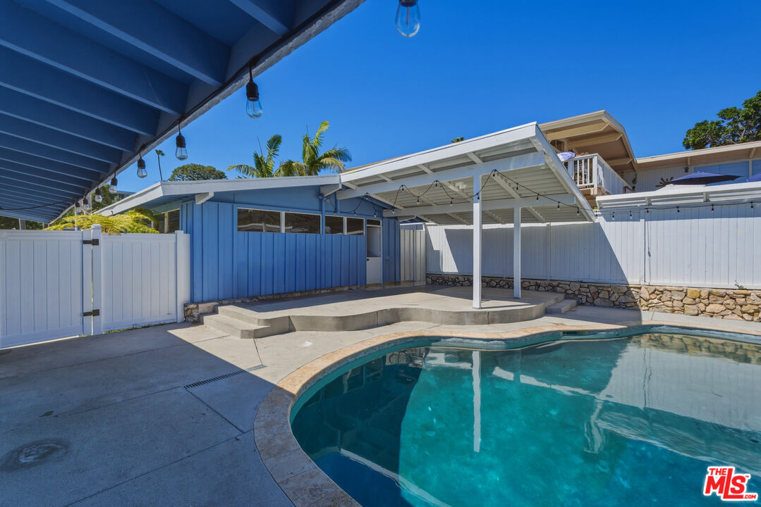 26 Packet Road Rancho Palos Verdes, CA 90275 - Photo 32 of 40 a view of a backyard with table and chairs with wooden fence