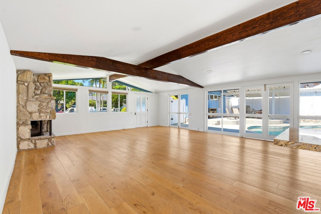 26 Packet Road Rancho Palos Verdes, CA 90275 - Photo 4 of 40 a view of empty room with wooden floor and floor to ceiling window