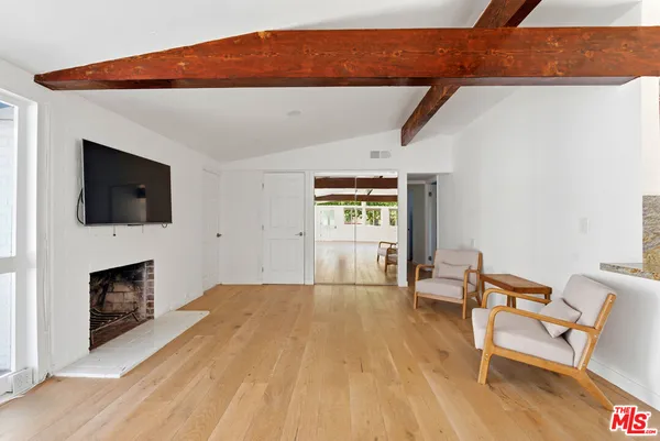 a view of livingroom with furniture and fireplace