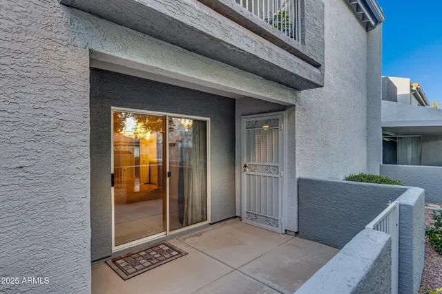 a view of a balcony with a tree