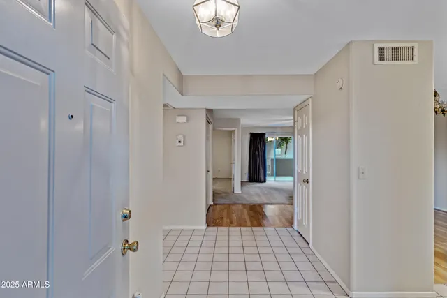 a view of a hallway view with wooden floor and staircase