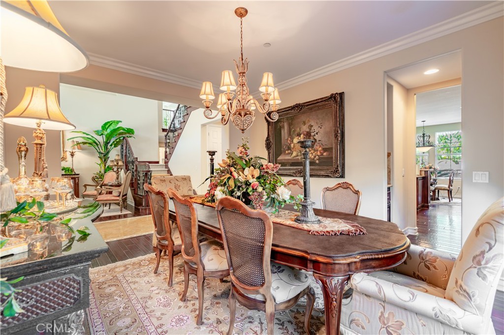 4023 Elderberry Circle Corona, CA 92882 - Photo 12 of 74 a view of a dining room with furniture and chandelier