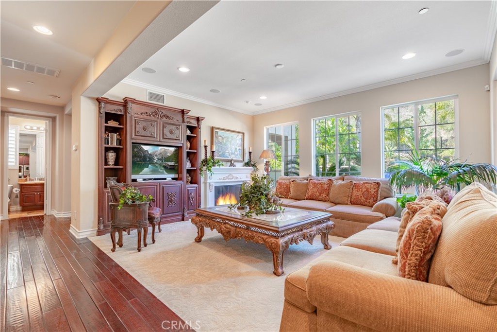 4023 Elderberry Circle Corona, CA 92882 - Photo 20 of 74 a living room with furniture and wooden floor