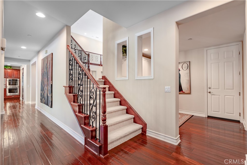 4023 Elderberry Circle Corona, CA 92882 - Photo 22 of 74 a view of entryway with wooden floor and stairs