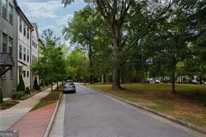 a view of a street with houses on both side