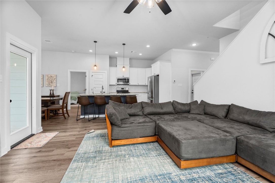 3027 Wolfpack Loop Bryan, TX 77808 - Photo 14 of 39 a living room with furniture and kitchen view