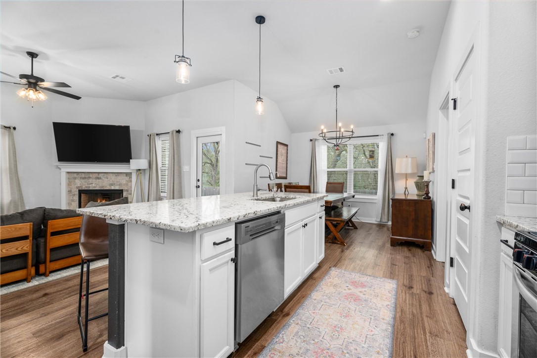 3027 Wolfpack Loop Bryan, TX 77808 - Photo 17 of 39 a large kitchen with kitchen island granite countertop lots of counter top space