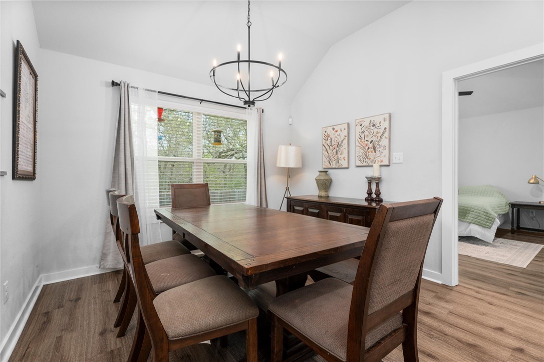 3027 Wolfpack Loop Bryan, TX 77808 - Photo 20 of 39 a view of a dining room with furniture window and wooden floor