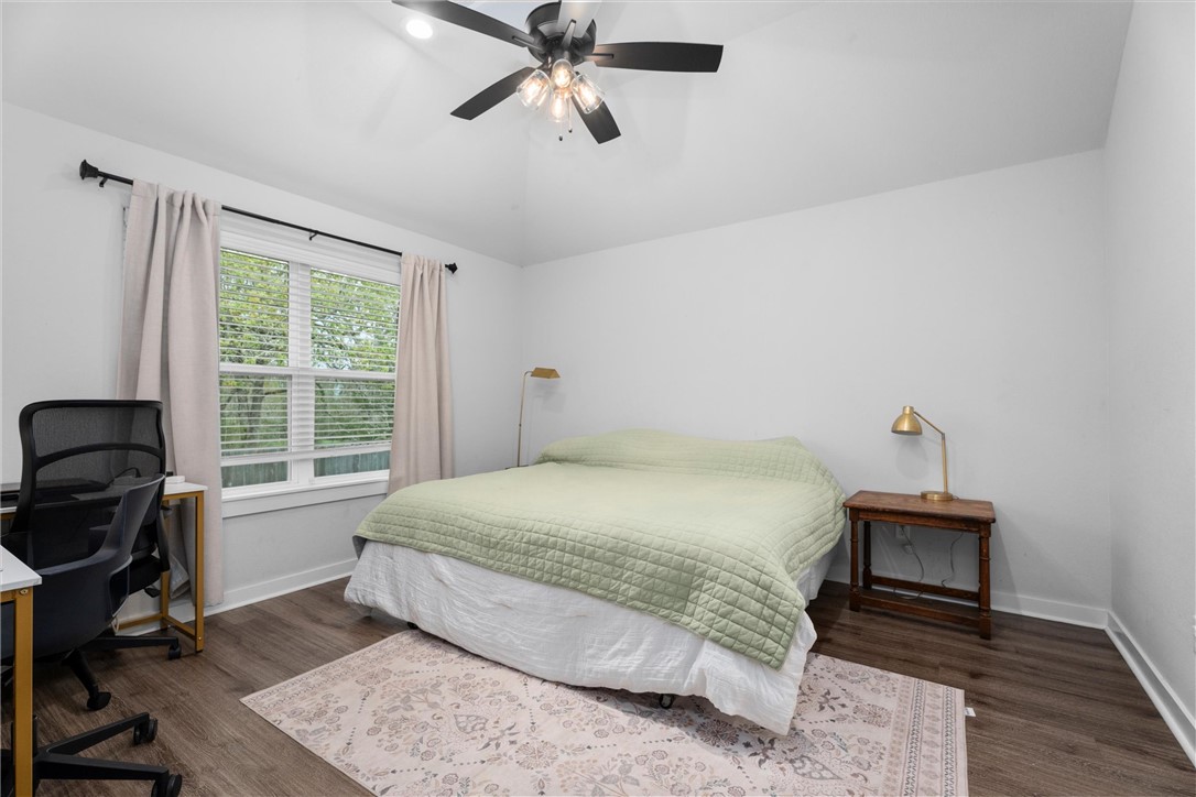 3027 Wolfpack Loop Bryan, TX 77808 - Photo 21 of 39 a bedroom with a bed and a window