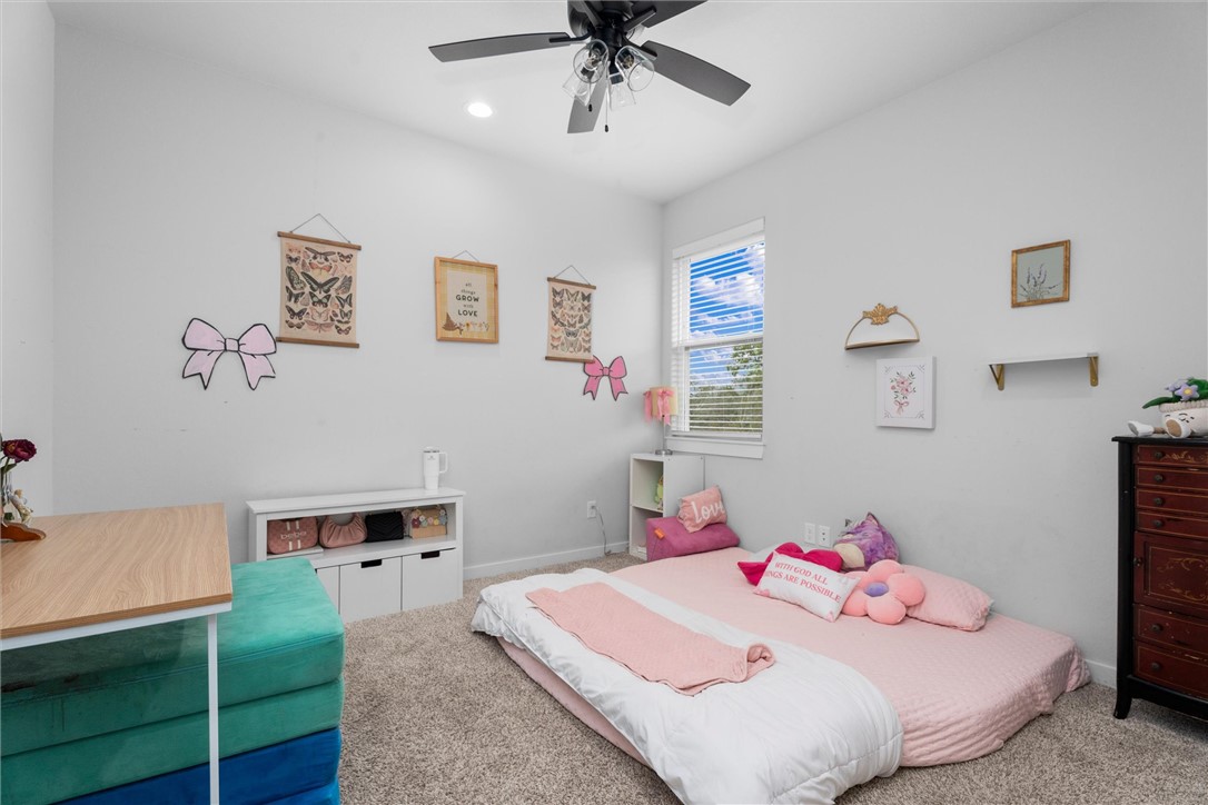 3027 Wolfpack Loop Bryan, TX 77808 - Photo 31 of 39 a bedroom with a bed and a desk