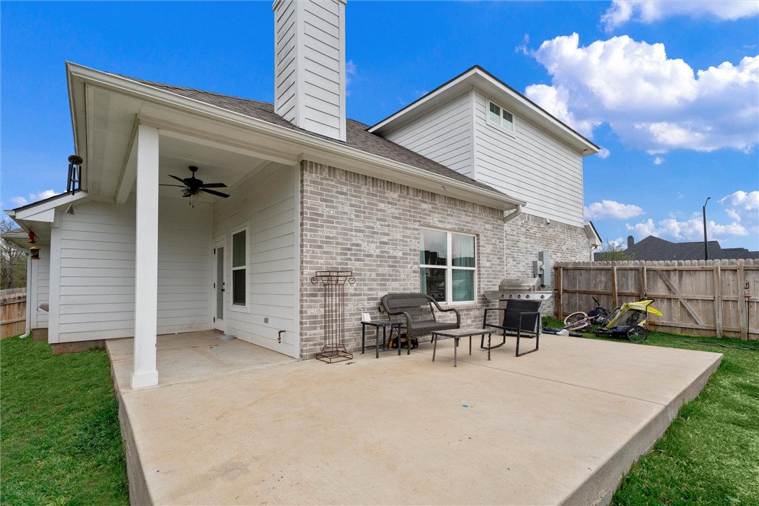 3027 Wolfpack Loop Bryan, TX 77808 - Photo 32 of 39 a view of kitchen with seating area and barbeque oven