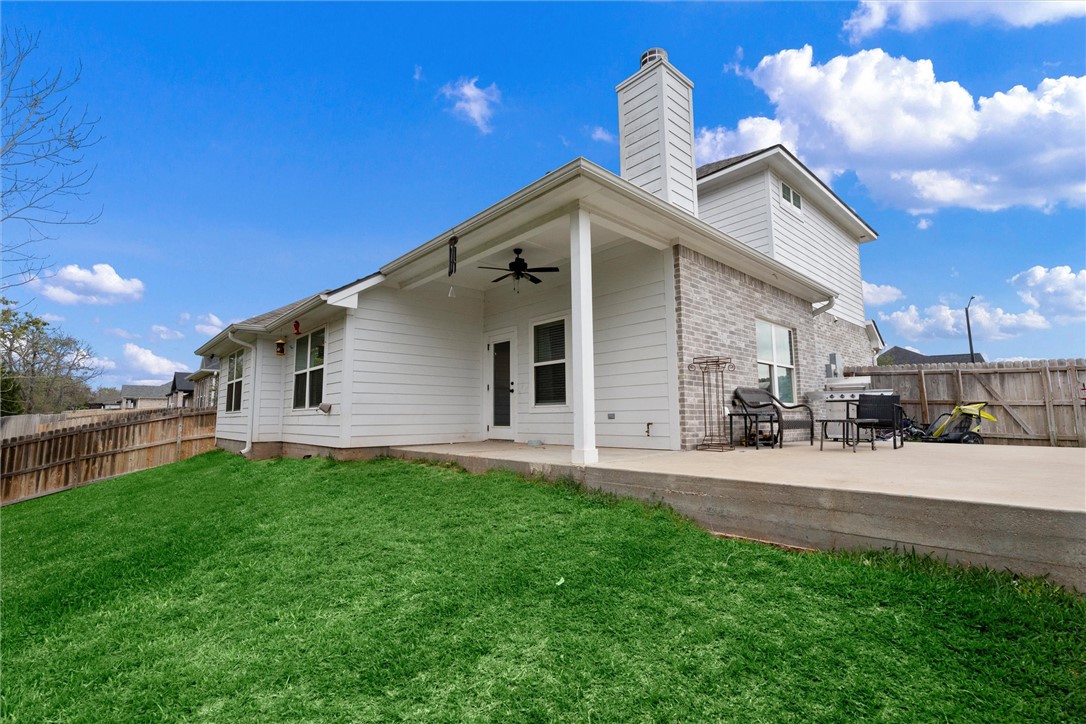3027 Wolfpack Loop Bryan, TX 77808 - Photo 33 of 39 a front view of a house with a yard and garage