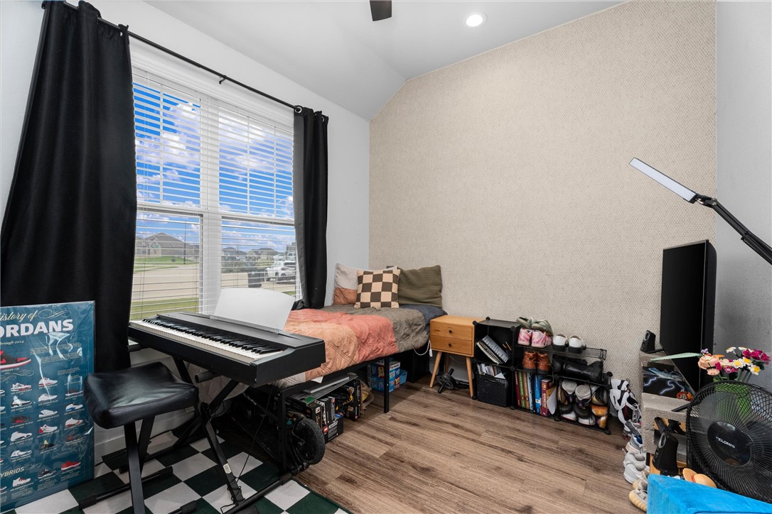 3027 Wolfpack Loop Bryan, TX 77808 - Photo 5 of 39 a view of a livingroom with furniture and a flat screen tv