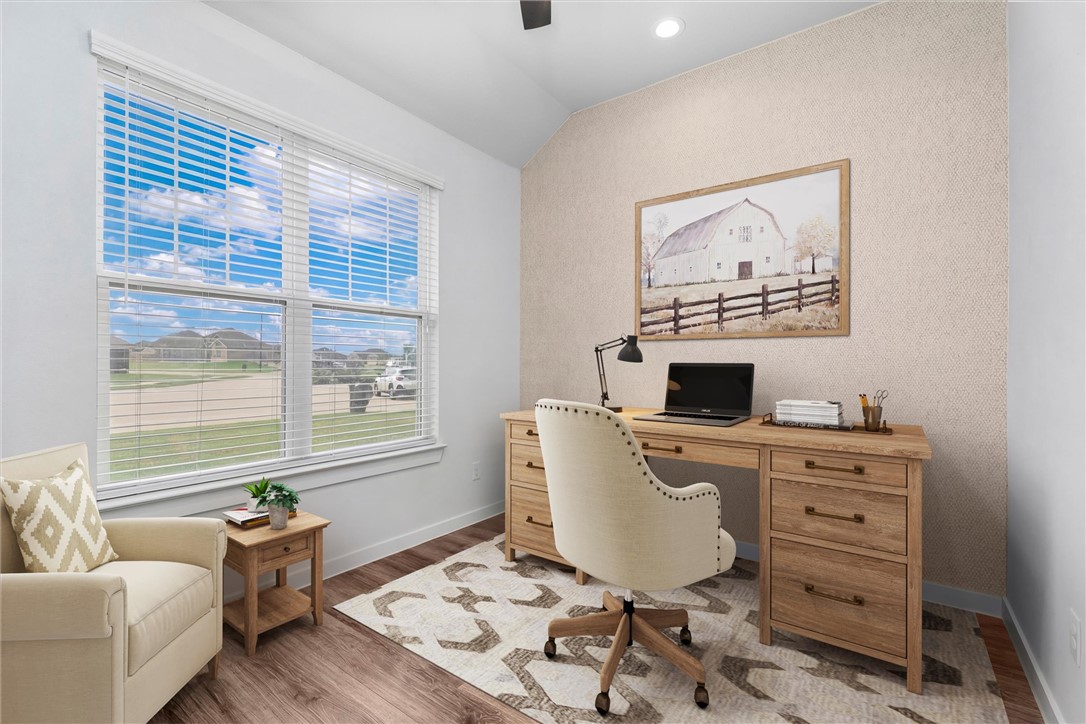 3027 Wolfpack Loop Bryan, TX 77808 - Photo 7 of 39 a living room with furniture and a flat screen tv