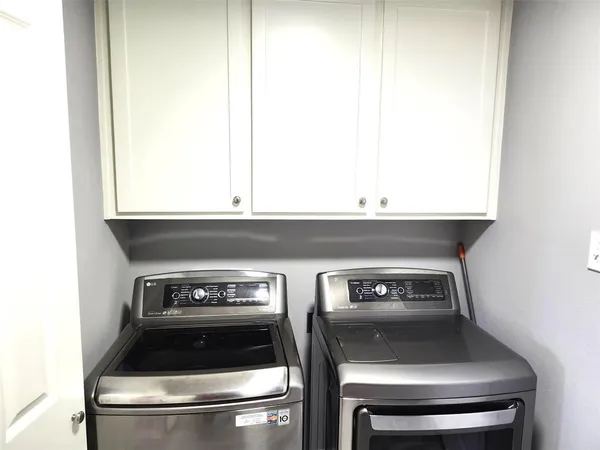 a stove top oven sitting inside of a kitchen