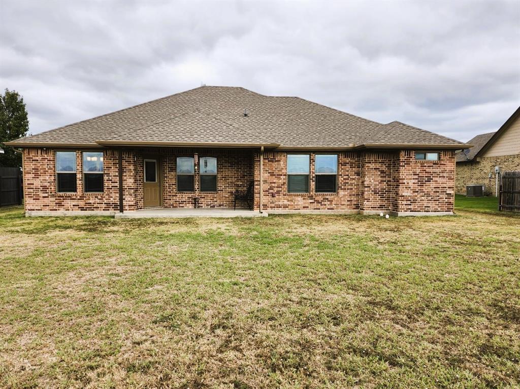 110 Joyce Street Whitney, TX 76692 - Photo 12 of 12 a front view of house with yard