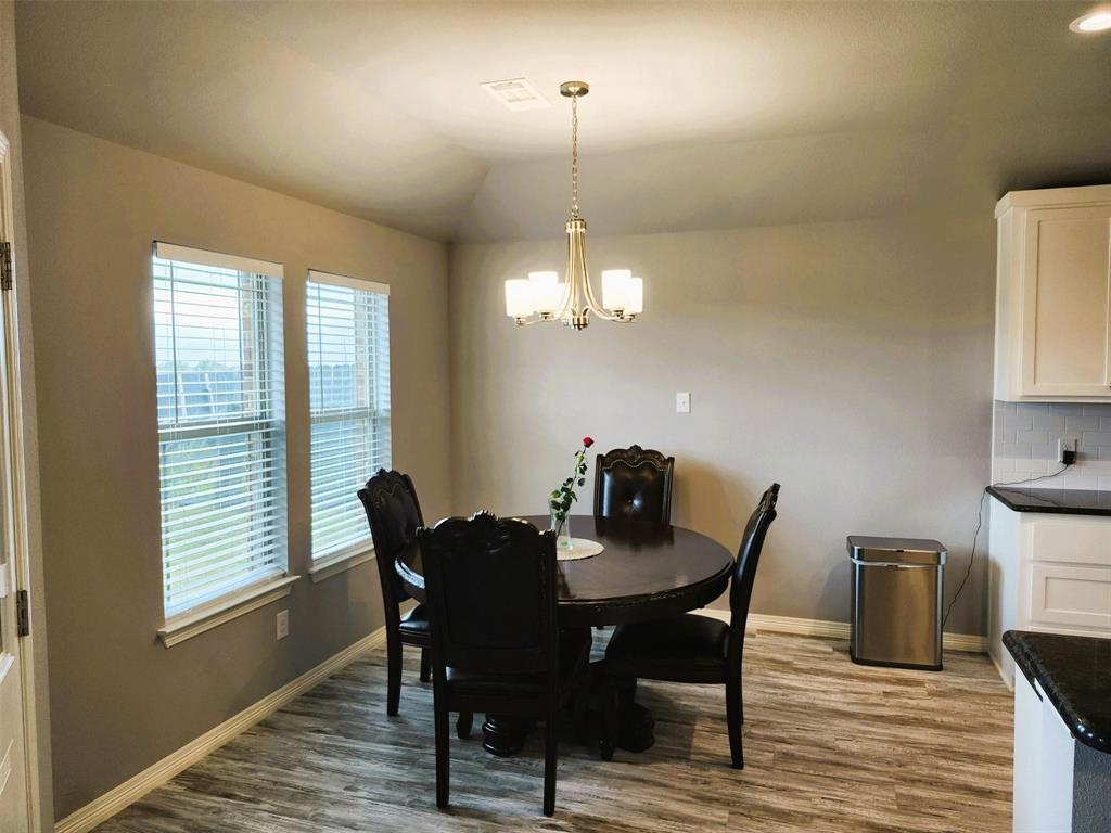 110 Joyce Street Whitney, TX 76692 - Photo 4 of 12 a view of a dining room with furniture window and wooden floor