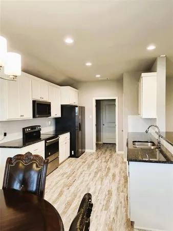 a bedroom with furniture and flat screen tv