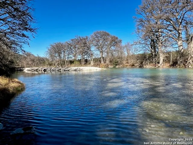 a view of lake with a yard