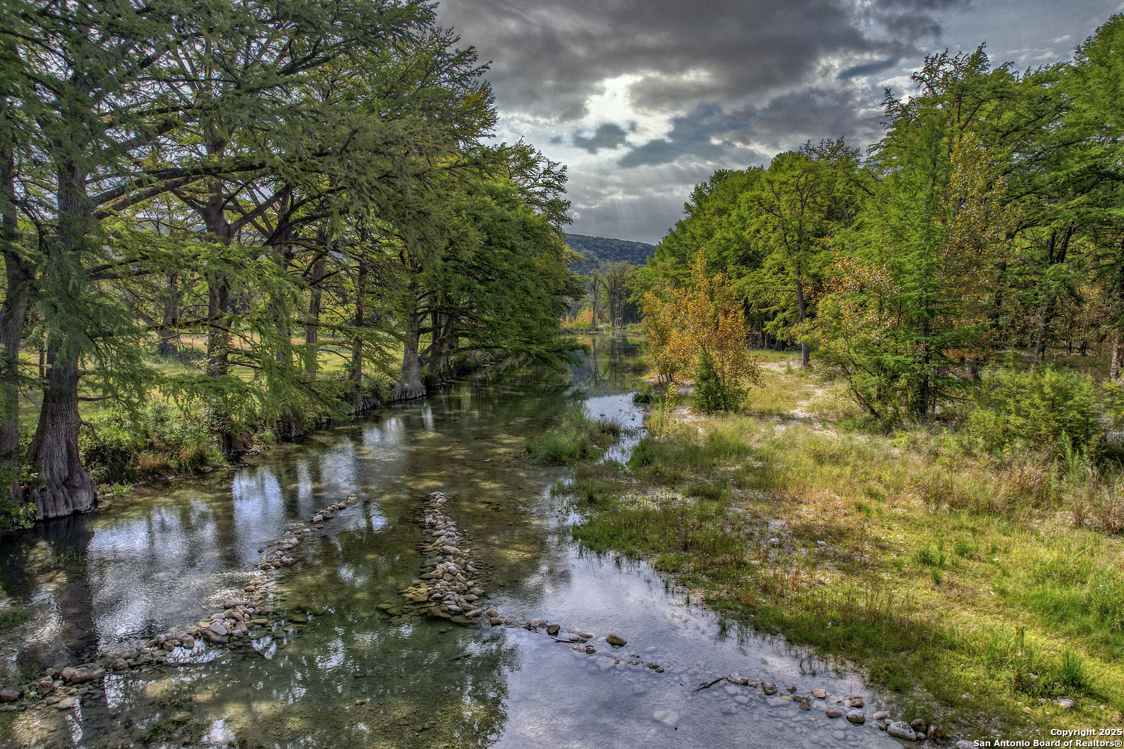 235 Madrone Concan, TX 78838 - Photo 8 of 9 a view of a lake with outside area