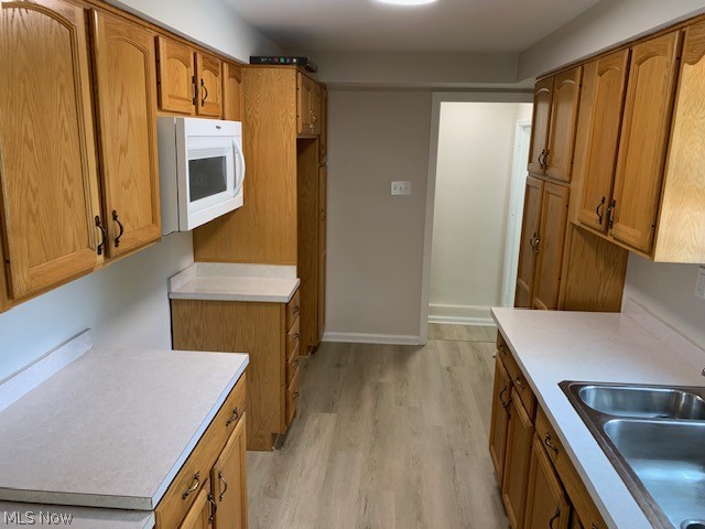 38522 Rogers Road Willoughby, OH 44094 - Photo 4 of 9 Kitchen with sink and light hardwood / wood-style flooring
