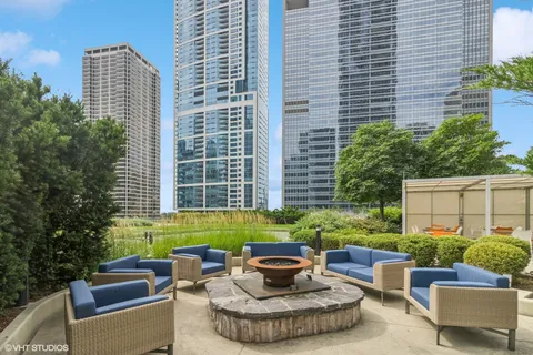 a view of a patio with a table and chairs
