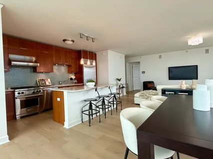 a kitchen with a table and chairs