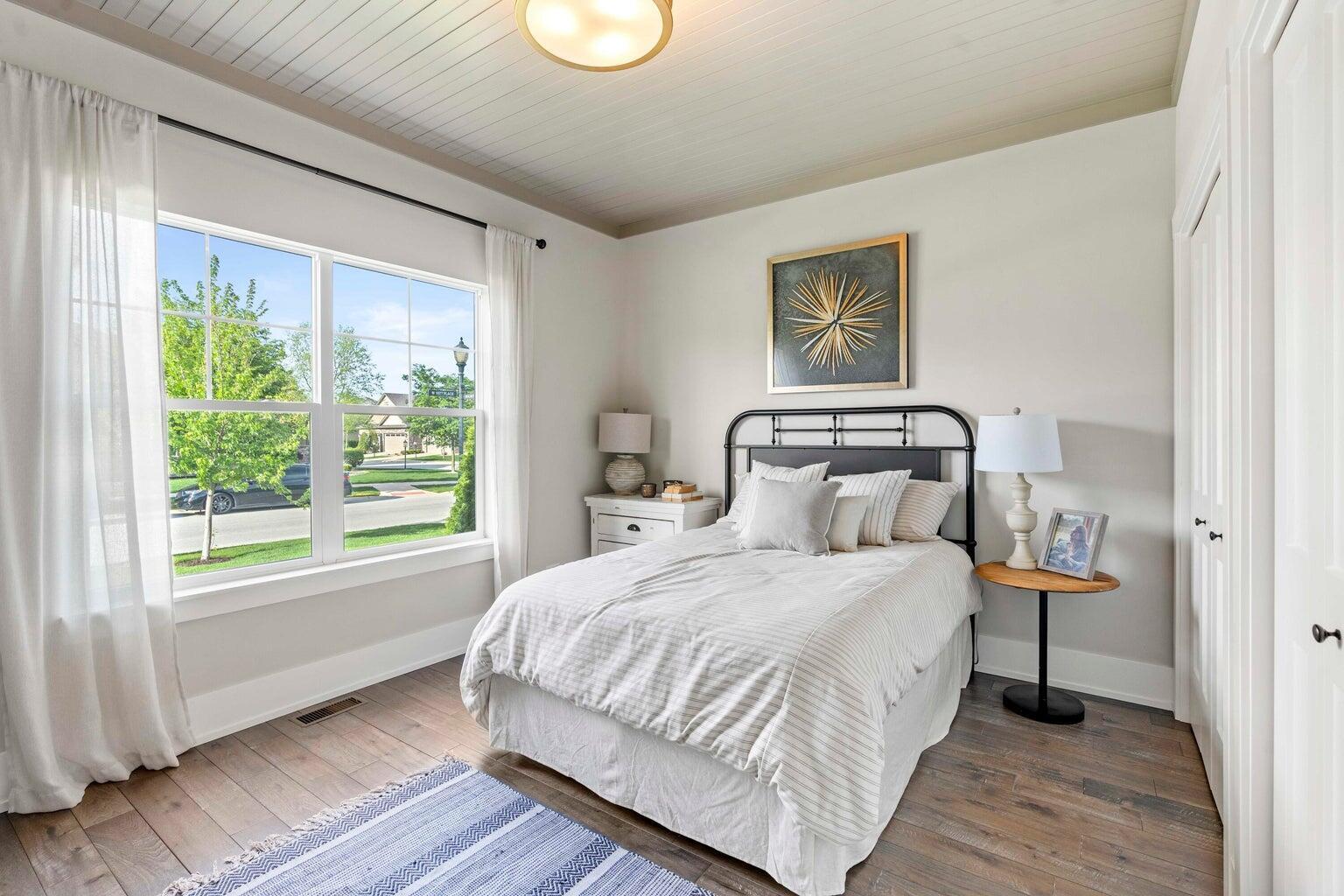 10883 Walnut Drive St. John, IN 46373 - Photo 12 of 30 a bedroom with a bed and a window