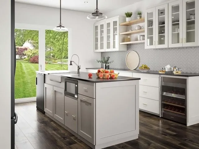 a kitchen with kitchen island white cabinets and white appliances