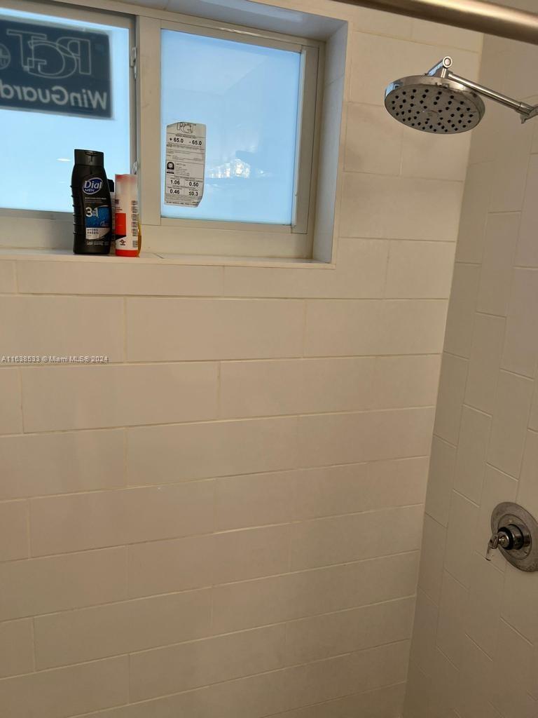 820 3rd Street, Unit 3 Miami Beach, FL 33139 - Photo 13 of 24 a bathroom with a window