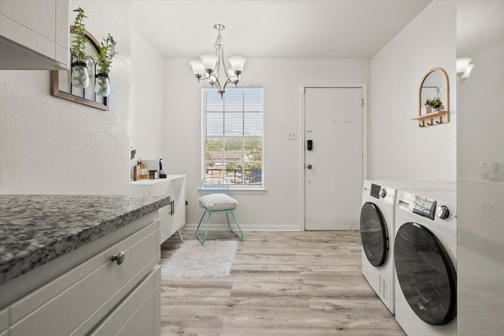 4100 Ridglea Country Club Drive, Unit 1401 Fort Worth, TX 76126 - Photo 11 of 27 a spacious bedroom with a bed and a chandelier